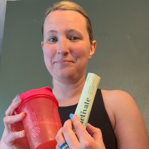 Sierra A. holding up shaker and Activate pouch